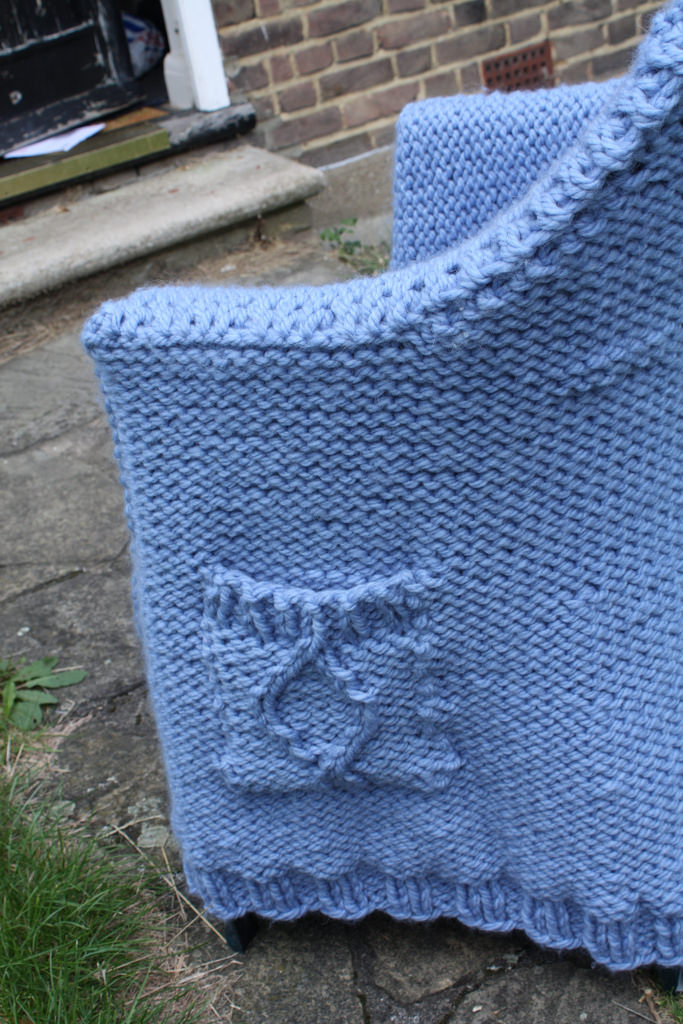 A Cable-Knit Cardigan Fit For a Chair ... Get the FREE Pattern