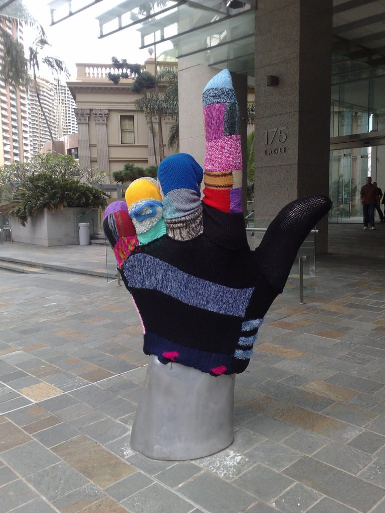 Big Knitted Glove Yarn Bomb In Brisbane