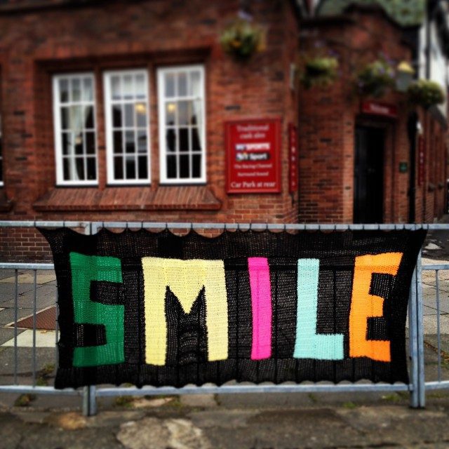 ‘Smile,’ Said the Yarn Bomb