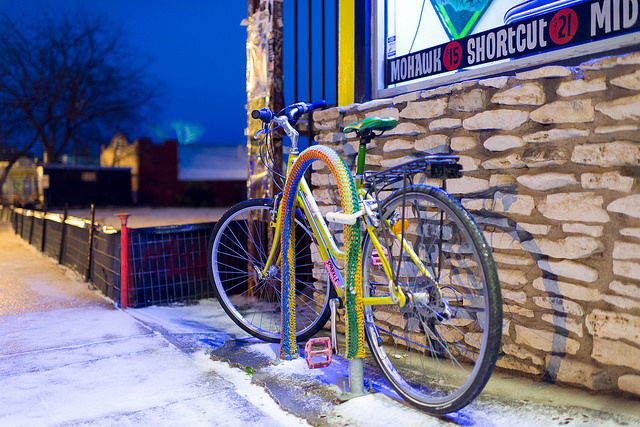 Snow in East Austin. Yarn Bomb. Excellent photograph. Layers and layers of subtext. Wow!