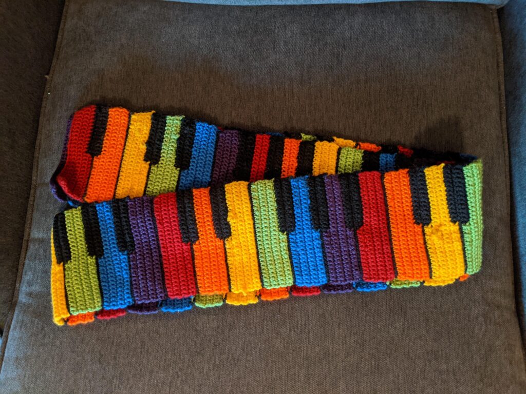 This Is What Happens When You Reimagine a Black & White Piano Scarf Pattern With a Rainbow Vibe
