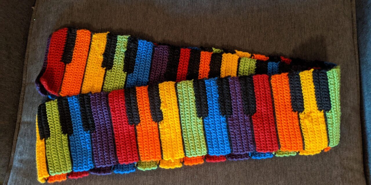 This Is What Happens When You Reimagine a Black & White Piano Scarf Pattern With a Rainbow Vibe