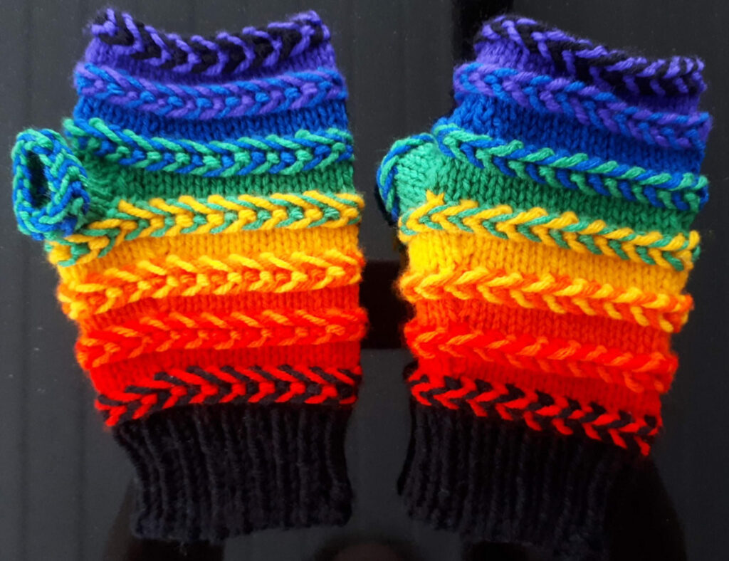 Knit a Pair of Rainbow Wrist Warmers and Learn How to Incorporate Latvian Braids Into Your Knitting!