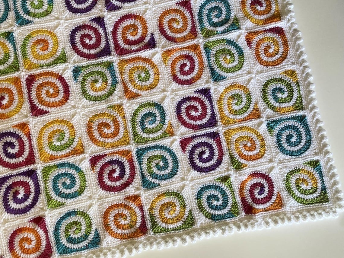 Spiral Granny Square Magic: Crochet a Cozy Baby Blanket Heirloom