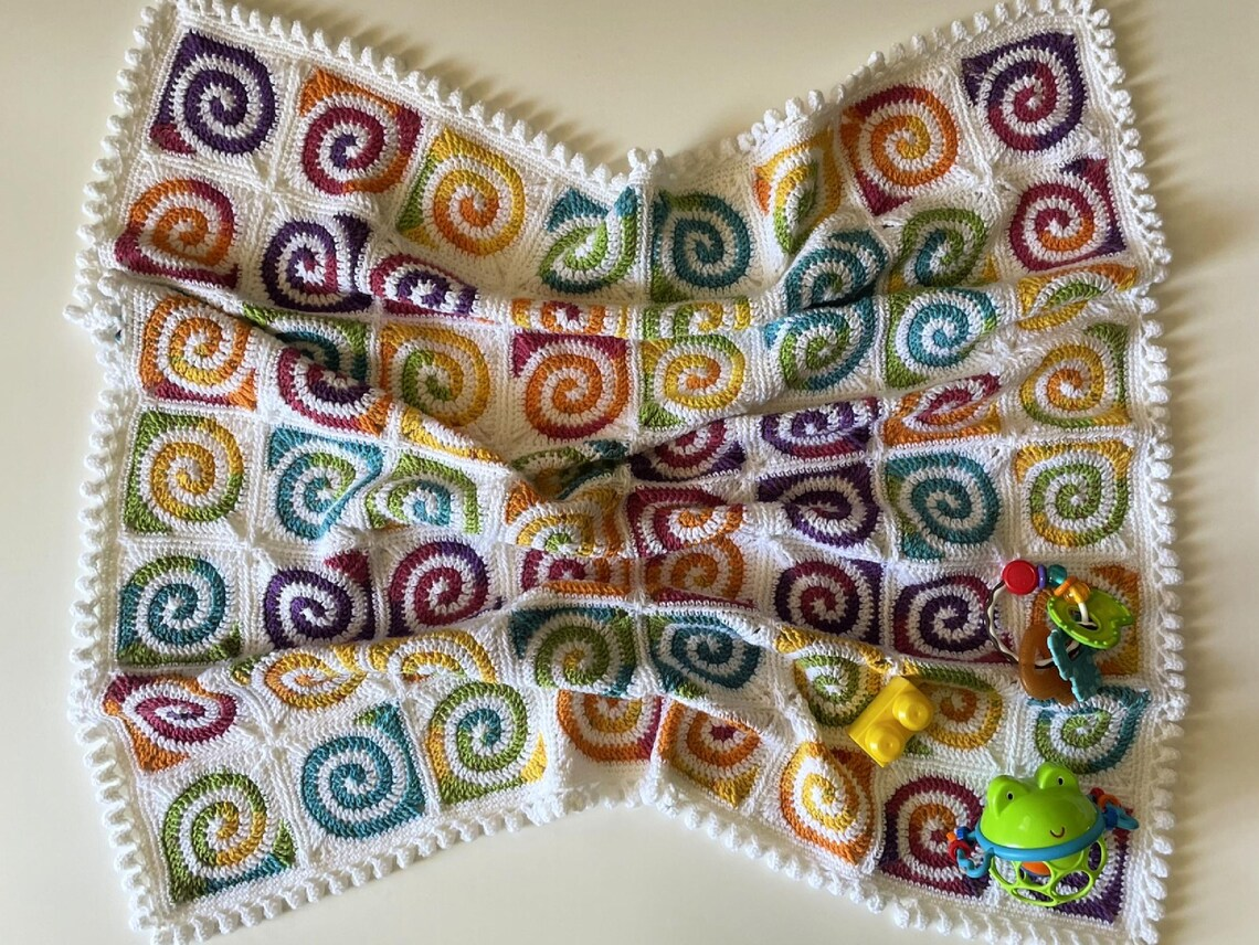 Spiral Granny Square Magic: Crochet a Cozy Baby Blanket Heirloom