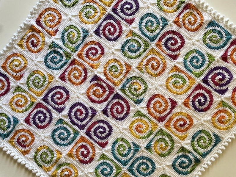 Spiral Granny Square Magic: Crochet a Cozy Baby Blanket Heirloom